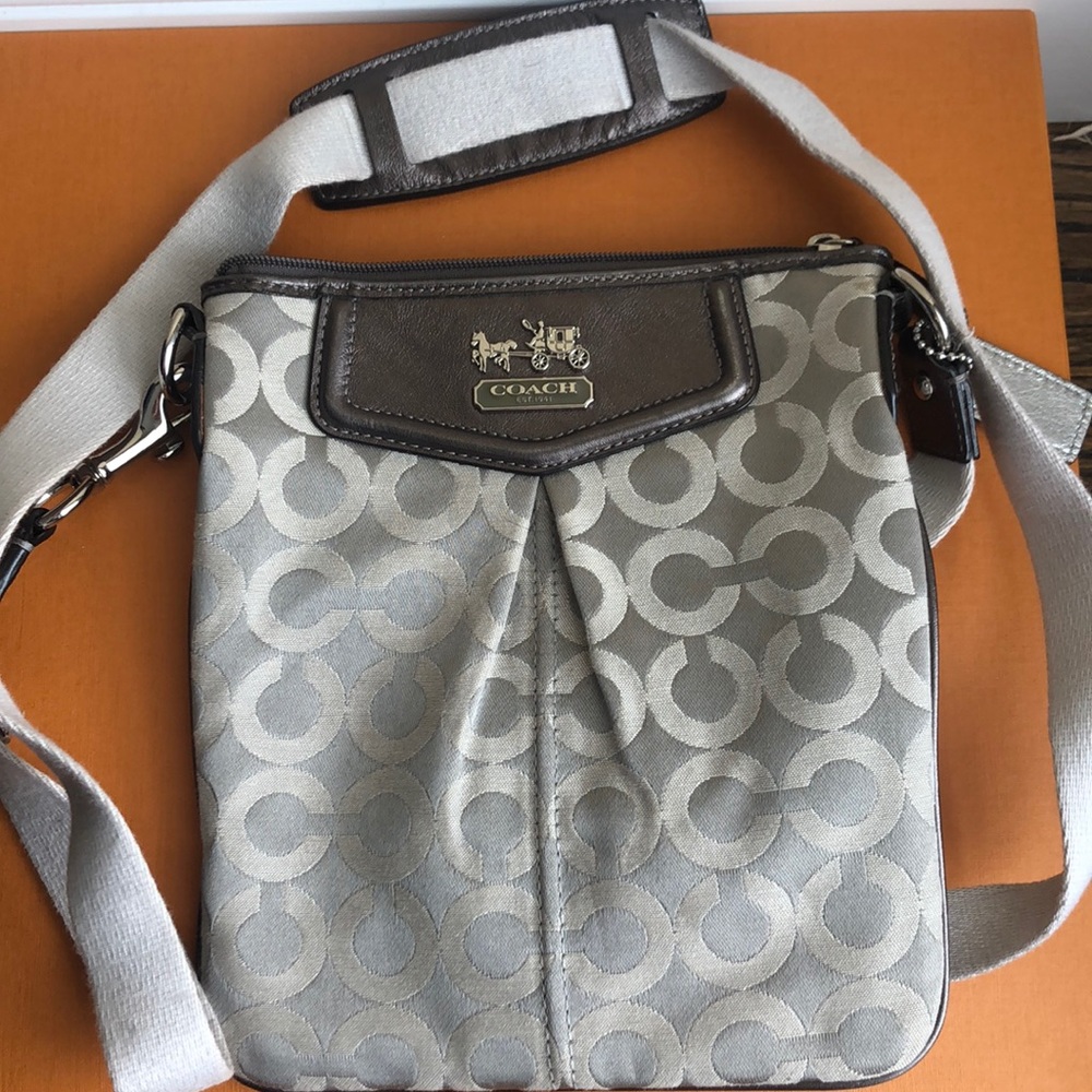 Gray and silver coach crossbody